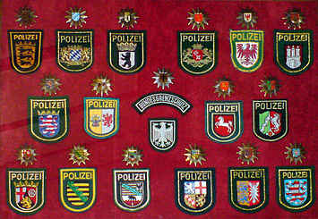 Sleeve and cap ensigns of the 16 state police forces and the former Bundesgrenzschutz (Federal Border Guard) Polizeien in Deutschland.jpg