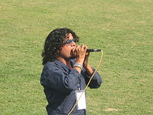 Kharel singing national song during 2013 ACC Twenty20 Cup