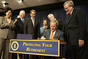 President George W. Bush signs into law H.R. 4...