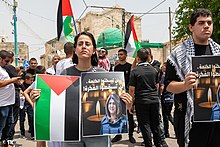 Protestors in Lod carrying photos of Palestinian-American journalist Shireen Abu Akleh who was shot dead while reporting in the West Bank on 11 May 2022 Protesters carring photos of Shireen Abu Akleh, Lod may 22.jpg