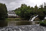 Pyrmont Mill on the Elzbach Falls with the castle behind