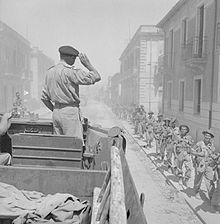 General Montgomery salutes his troops from a DUKW, Reggio, Italy, September 1943. The British Army in Italy September 1943 NA6222.jpg