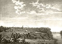 A black-and-white drawing of a fort and various small buildings on a bluff surrounded by trees above a river
