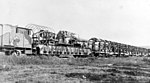 A mle 1915 with its supply carriages.