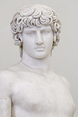 The Farnese Antinous with engraved pupils and signature wig-like hair.