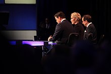 Bret Baier, Megyn Kelly, and Chris Wallace moderating the 2016 Republican Party Presidential debate Bret Baier, Megyn Kelly & Chris Wallace (24107472813).jpg
