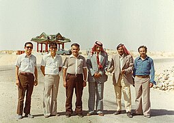 Engineers and officials standing in front of the Pavilion of Friendship