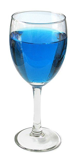 Wineglass with blue liquid