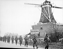 II Canadian Corps troops of the Regiment de Maisonneuve advancing along the road from Holten to Rijssen, the Netherlands, April 9, 1945. Holten-Rijssen April 1945.jpg