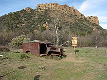 M*A*S*H site in Malibu Creek State Park. Burnt-out Dodge WC54 ambulance used in filming. A replica of the iconic M*A*S*H signpost was installed on the site in 2008. MASH site - Malibu Creek State Park - 2 January 2010.jpg