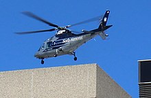 Air ambulance landing at HCMC in downtown Minneapolis North Memorial AirCare 20161018.jpg