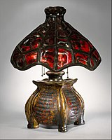 Table lamp, with glass and metal shade by Tiffany & Co., by 1902.[15]