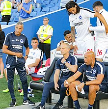 Hughton (left) with coaching staff and players prior to pre-season match against Nantes in August 2018 BHA v FC Nantes pre season (cropped).jpg