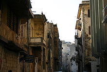 War-damaged buildings in Beirut Beirut- building from before civil war.jpeg