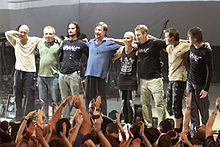 DDT is best known for Yuri Shevchuk's symbolist lyrics and feature a strong bard music influence DDT Caesarea 2012.JPG