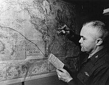 Captain Beach traces the route of Triton's submerged circumnavigation Edward L. Beach, Jr.jpg