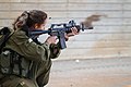 IDF soldier firing a Colt Model 653 with MEPRO 21 reflex sight.