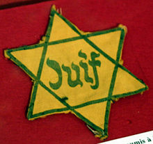 During Nazi rule, Jews were forced to wear yellow stars which identified them as such. Jews are an ethno-religious group and Nazi persecution of them was based on their race. Juif.JPG