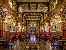 The Grade I listed King's College London Chapel on the Strand Campus seen today was redesigned in 1864 by Sir George Gilbert Scott King's College London Chapel 2, London - Diliff.jpg