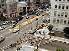 Electronic news-gathering trucks and photojournalists gathered outside the Prudential Financial headquarters in Newark, United States in August 2004 following the announcement of evidence of a terrorist threat to it and to buildings in New York City. Newark-prudential-terrorist-threat-media-2004.jpg