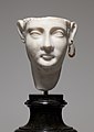 Egyptianising marble head of an Alexandrian composite statue depicting a Ptolemaic queen as Isis. Note the gold earring still surviving in the left ear.