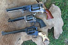 From Top: Replica of 1849 vintage. .44 Colt Revolving Holster Pistol (Dragoon); Colt Single Action Army Model 1873; Ruger (New Model) Super Blackhawk- Mid and late 20th Century Single Action Evolution..jpg
