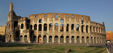 The exterior of the Colosseum, showing the partially intact outer wall (left) and the mostly intact inner wall (center and right)