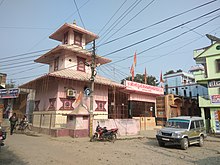 Pink temple on a street corner
