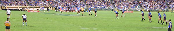 The Western Force from Western Australia (blue team) restarts against the Waratahs from New South Wales (white team) in the Super 14 competition.