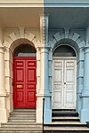 Close-up of the red and white doors of the coloured houses of Grand Parade, Plymouth