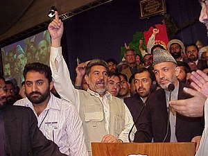 Chairman Hamid Karzai surrounded by supporters...