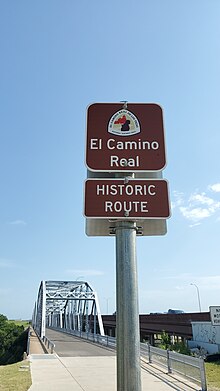 National Park Service signage for El Camino Real de los Tejas Trail is located at the south entrance to the historic Montopolis Bridge Montopolis Bridge NPS signage for El Camino Real de los Tejas Trail.jpg