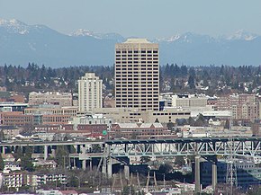 The U-District, looking northeast from Queen Anne. UW Tower is the tall building in the center, with the Hotel Deca (originally the Meany Hotel) to its left. The I-5 Ship Canal Bridge is in the foreground.