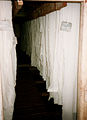 White crepe hanging in a drying shed