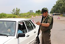 Ukrainian National Guard soldier in a security checkpoint near the JFO zone, 2019. Uchast' NGU v operatsiyi Ob'iednanikh sil IMG 2022 (49718977138).jpg