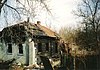 Een na de ramp verlaten dorp nabij Tsjernobyl