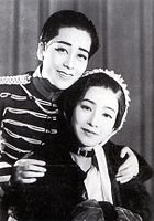 Sonoi seated with Ashihara as her son