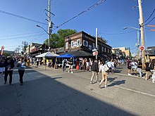 On Sundays in all seasons except winter, part of Kensington Market is restricted to pedestrian traffic only. Augusta Ave during holiday 2022.jpg