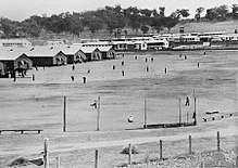 Japanese POWs practice baseball near their quarters, several weeks before the Cowra breakout. This photograph was taken with the intention of using it in propaganda leaflets, to be dropped on Japanese-held areas in the Asia-Pacific region. Cowrapowcamp.jpg