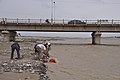 Digging for jade under the G315 Highway bridge over the Hotan River