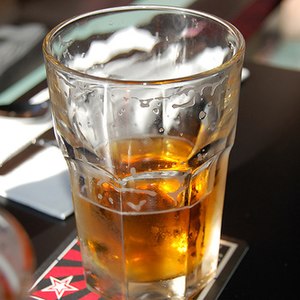 A half-drunk glass of beer