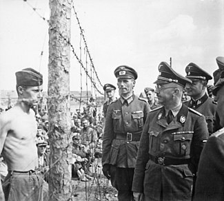 Himmler besichtigt die Gefangenenlager in Russland. Heinrich Himmler inspects a prisoner of war camp in Russia, circa... - NARA - 540164.jpg