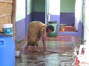 An Indian woman housekeeps work.