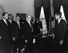 President Kennedy is shown a model of Mariner 2 during a meeting with NASA officials after the successful completion of the mission, 1963 Kennedy Receives Mariner 2 Model.jpg