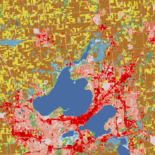 Land cover surrounding Madison, Wisconsin. Fields are colored yellow and brown and urban surfaces are colored red. NLCD landcover MSN area.png