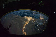 space photograph showing the inhabited areas of the Nile glowing against the dark desert