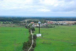 Village Pagórki with water tower and foundations for wind turbines of a future wind park.