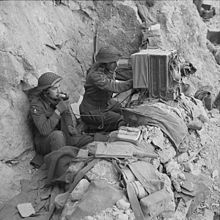 Signallers of the 6th Battalion, Queen's Own Royal West Kent Regiment, use a radio in a dugout on Monastery Hill. The Battle of Cassino, January-may 1944 NA13363.jpg