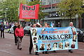 Belfast 2012. Ofiary masakry w Ballymurphy na transparencie marszu związkowców.