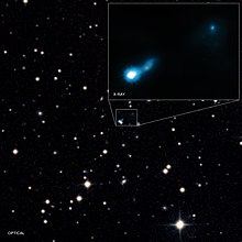 X-ray jet made from a supermassive black hole found by NASA's Chandra X-ray Observatory, made visible by light from the early Universe B30727.jpg